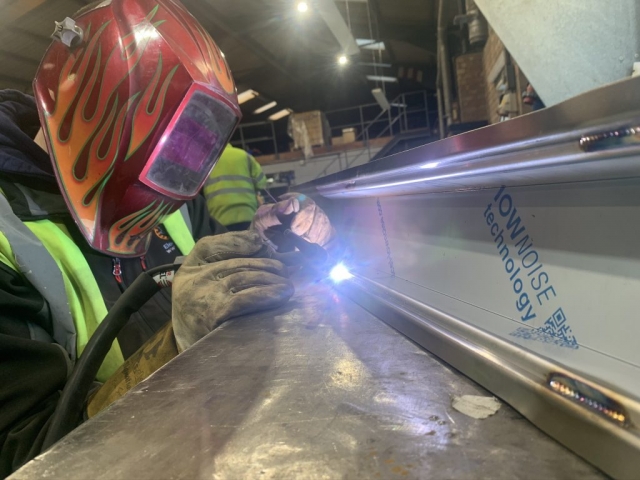 Cubit Engineering’s skilled Fabricator Andy welding some bespoke metal chutes